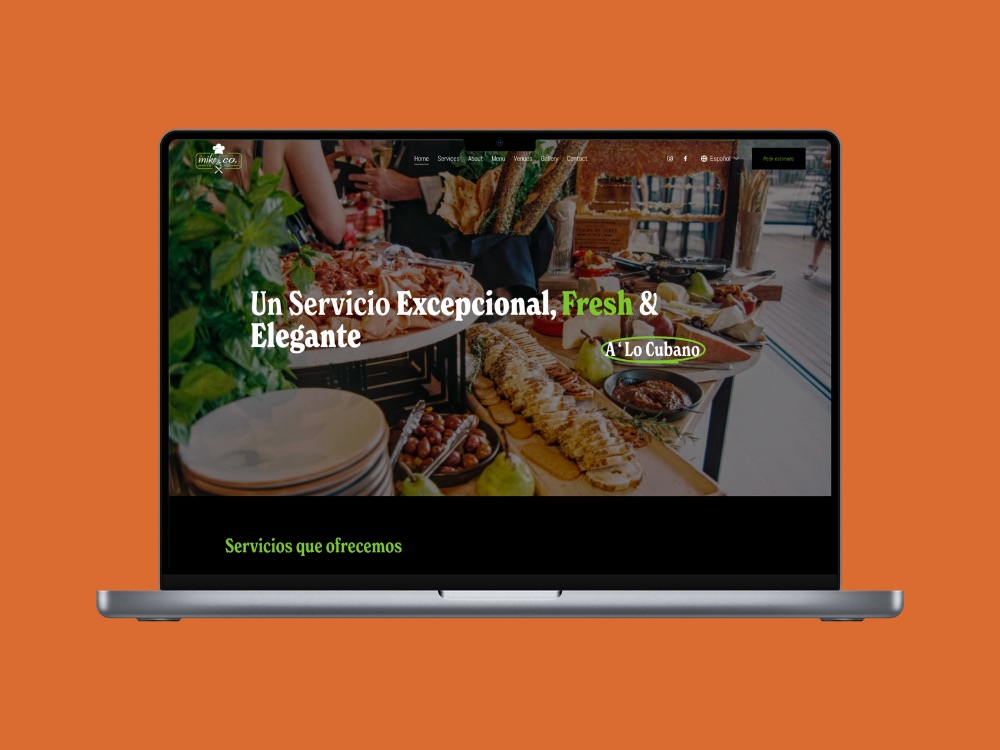 Laptop showing a restaurant website velaztek designed, on an orange background